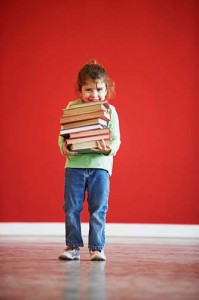 little-girl-carrying-books