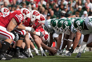 Wisconsin linemen face off at the line of scrimmage with Michigan State University players during a football game at Camp Randall Stadium at the University of Wisconsin-Madison on Sept. 29, 2007. Wisconsin won game, 37-34. ©UW-Madison University Communications 608/262-0067 Photo by: Jeff Miller Date: 09/07 File#: NIKON D200 digital frame 2041